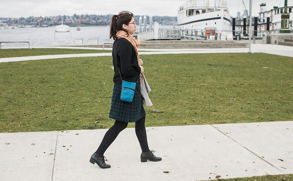A person carrying the P.I.K.A. Pouch.